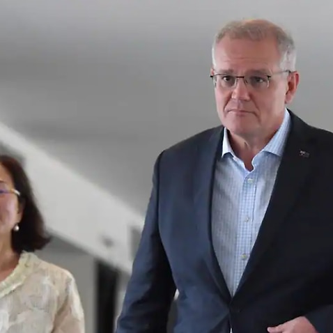 Liberal member for Chisholm Gladys Liu and Prime Minister Scott Morrison leave after a Good Friday service at the Syndal Baptist Church. Friday, April 15, 2022. 