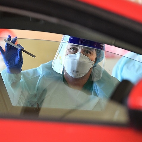 South Australia Hospital staff simulate a drive-through coronavirus testing at the Repatriation Hospital in Adelaide, Tuesday, 10 March, 2020.