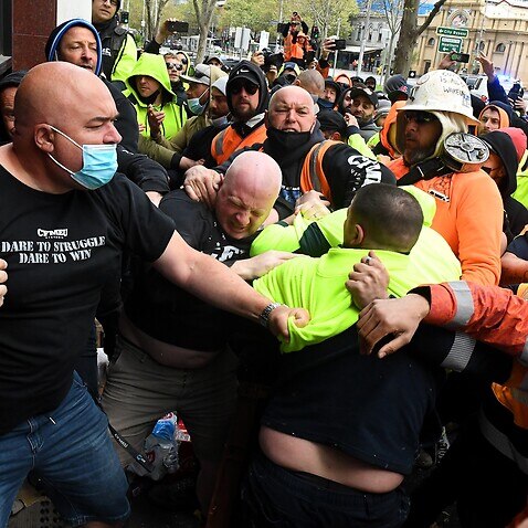 Construction workers clash with unionists at a protest at Construction, Forestry, Maritime, Mining and Energy Union (CFMEU) headquarters in Melbourne. 