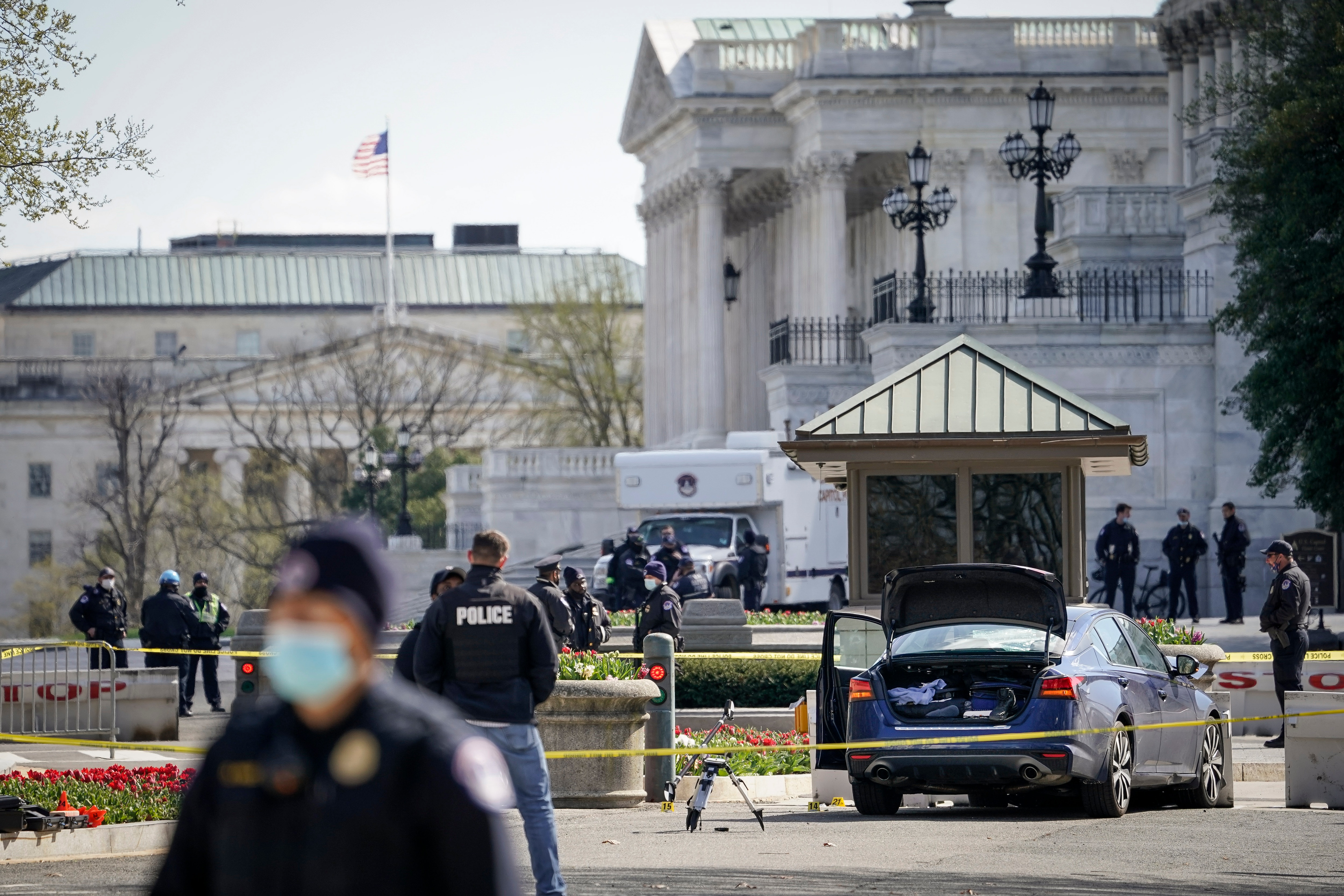 Police investigate the scene after a vehicle charged a barricade at the US Capitol on 2 April in Washington, DC. 