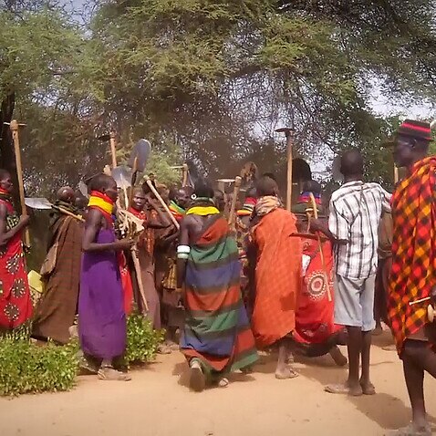 Kangalitai villagers dancing and singing (AP)