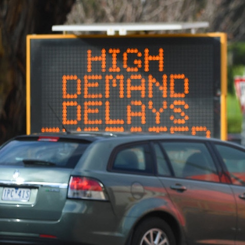 Traffic management is seen outside a COVID-19 testing facility at Northland shopping centre in Melbourne, Wednesday, 24 June, 2020. 