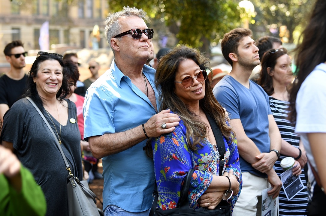 Australian musician Jimmy Barnes and wife Jane Barnes join the rally in Sydney's Hyde Park. 