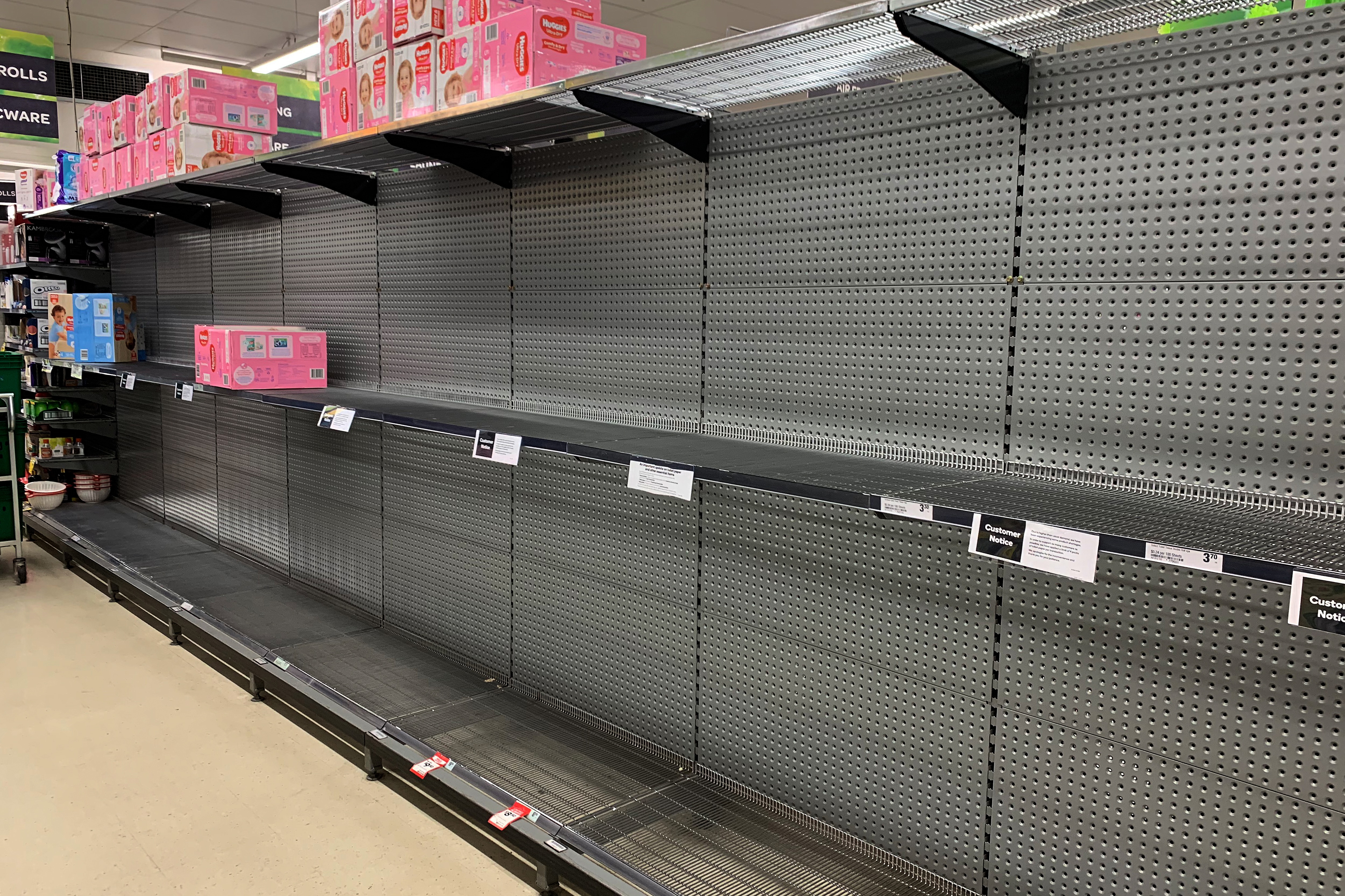 Empty shelves that were once stocked with toilet paper are seen in Balmain Woolworths, Sydney, Saturday, March 7, 2020. Australians are stockpiling toilet paper over Coronavirus fears. (AAP Image/Bianca De Marchi) NO ARCHIVING