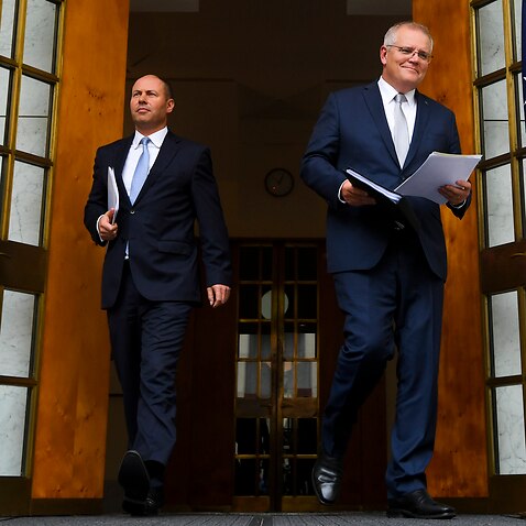 Australian Prime Minister Scott Morrison (right) and Australian Treasurer Josh Frydenberg arrive for a press conference at Parliament House in Canberra, Thursday, March 18, 2021. (AAP Image/Lukas Coch) NO ARCHIVING
