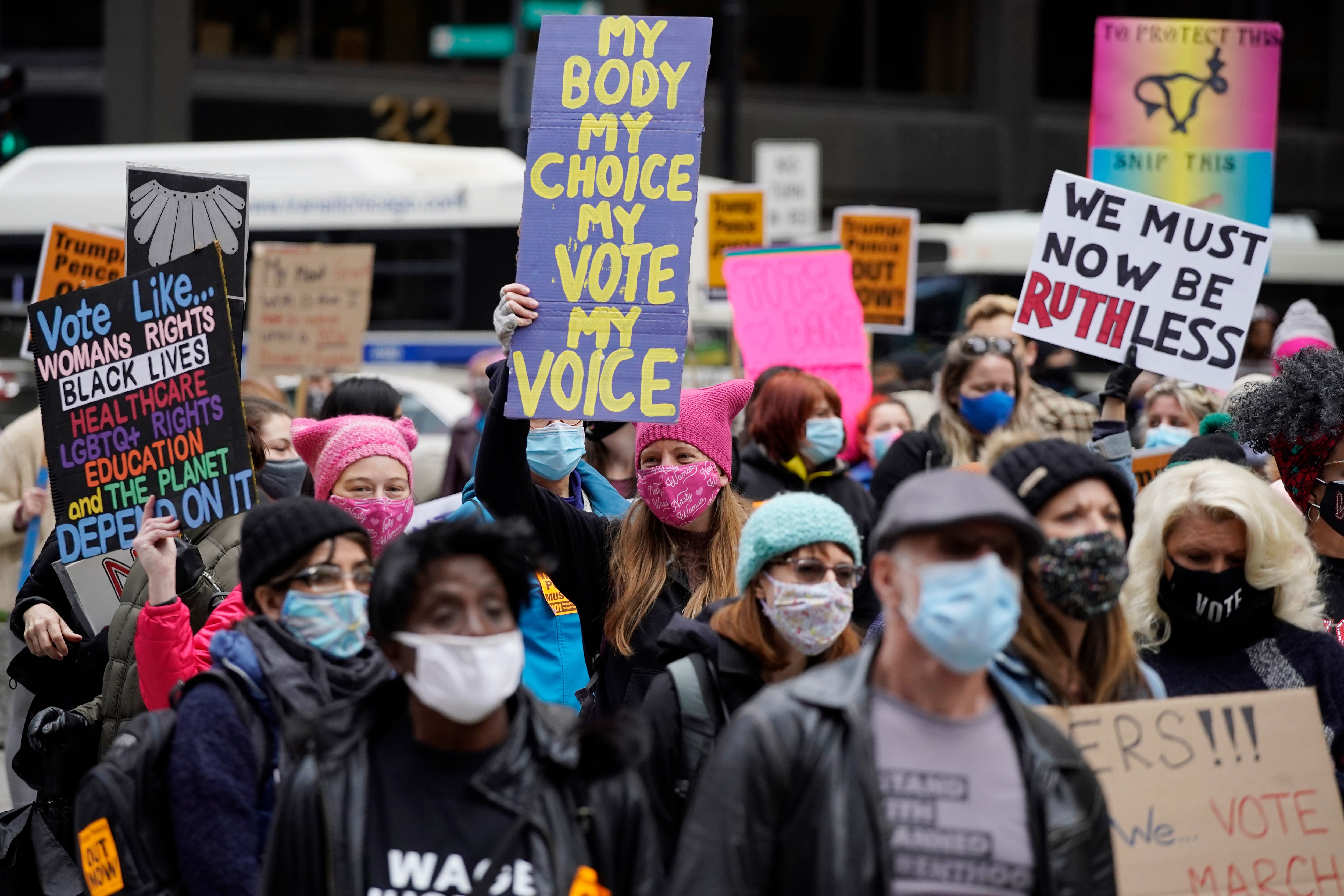 People march during the Women's March in downtown Chicago, Saturday, Oct. 17, 2020.