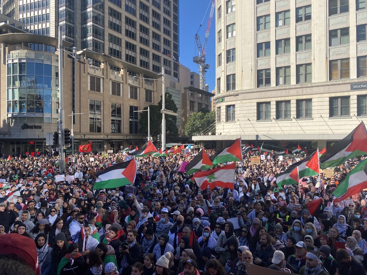 Large crowds gather at Sydney Town Hall to protest against escalating violence between Israel and Palestinian militants in Gaza.