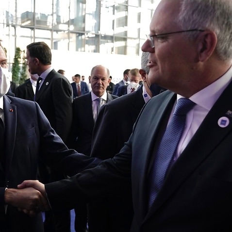 Prime Minister Scott Morrison attends the G20 Official Welcome and Family photo and chats with French President Emmanuel Macron in Rome on 30 October, 2021. 