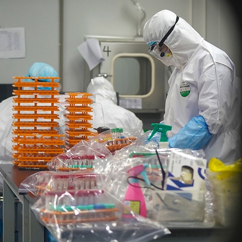 Medical workers at a coronavirus detection lab in Wuhan in central China's Hubei Province.