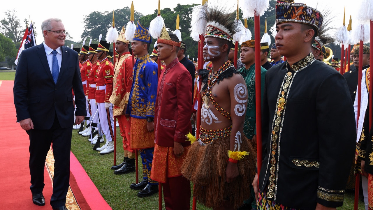 Australian Prime Minister Scott Morrison inspects a guard of honor during a welcoming ceremony at Bogor Presidential Palace near Jakarta.
