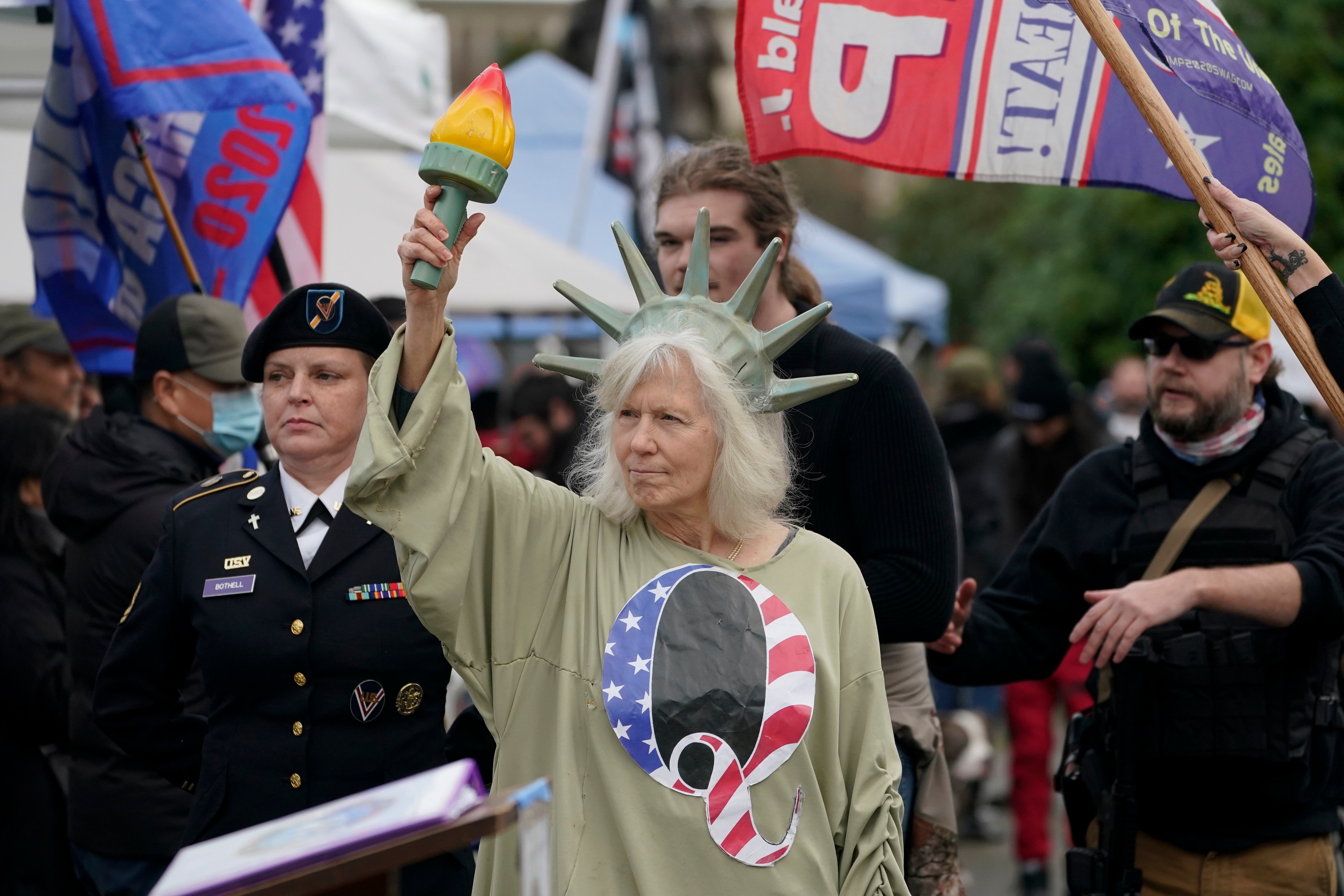 A person wears a shirt with the letter Q, referring to QAnon, during events at the US Capitol on Wednesday, Jan 6, 2021