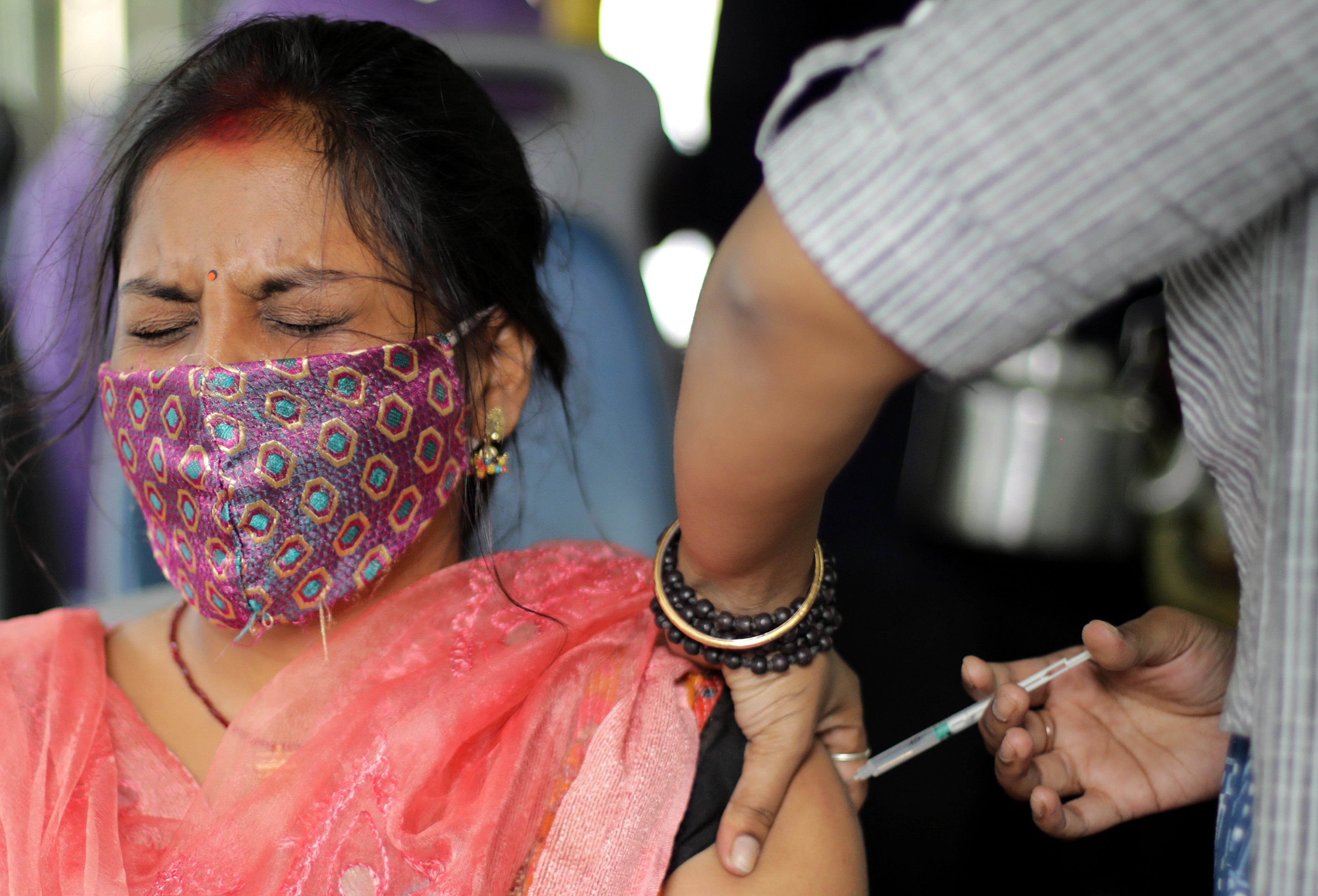 A woman receives her vaccine in Kolkata, India. The highly Delta variant was first identified in India.