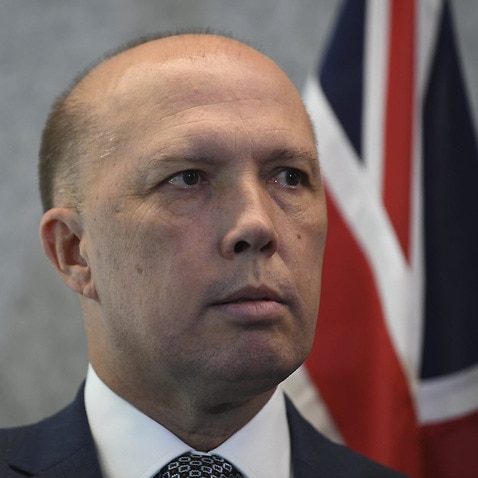 Australian Home Affairs Minister Peter Dutton speaks to the media
