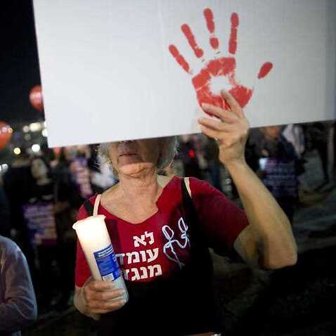 Fortnite Gamer Accused Of Live Streaming Domestic Violence Assault - a woman hold sign during a protest against violence against women in tel aviv israel