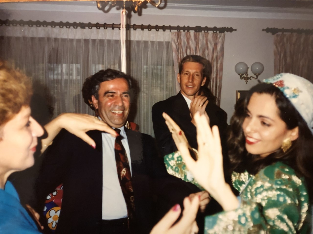 Maya's mother Atousa, father Peter, and grandparents Fozieh and Ali dancing.