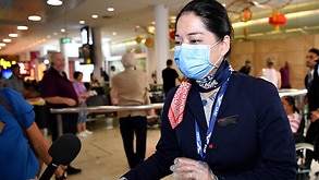 China Eastern Airlines flight crew wear protective masks on arrival at Sydney Airport. There are now four confirmed cases of coronavirus in Australia.