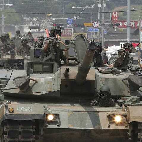 South Korea Army soldiers ride K-1 tanks during the annual exercise in Paju, South Korea, near the border with North Korea, Wednesday, July 5, 2017. 