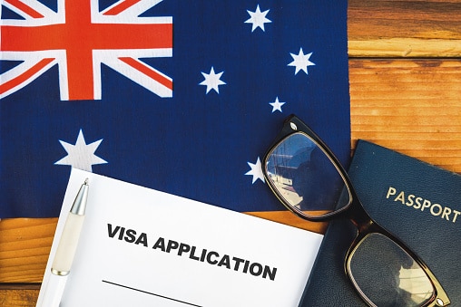 Flag of Australia , visa application form and passport on table