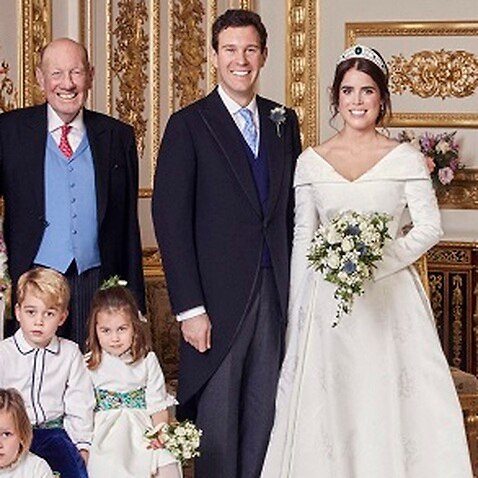 Mother of the bride Sarah Ferguson joins other members of the royal family and the groom's family for an official photo.