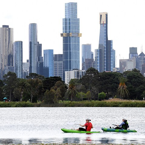People are seen canoeing at Albert Park Lake in Melbourne, Thursday, October 7, 2021. 