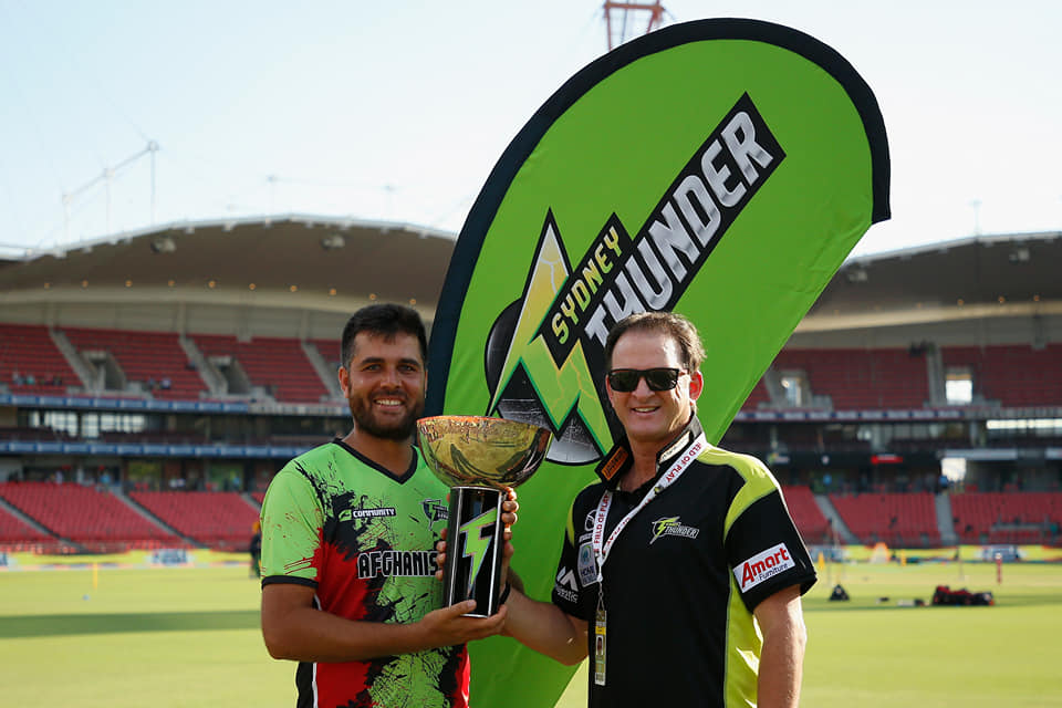Mark Waugh (right) congratulates Hameed Kherkhah after he wins the Sydney Thunder community rookie role.