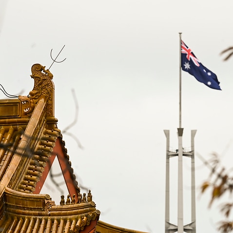 The Australian Parliament is seen behind the roof of the Chinese Embassy in Canberra.