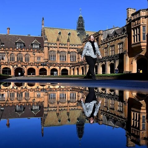 Person walking in Sydney University quadrangle