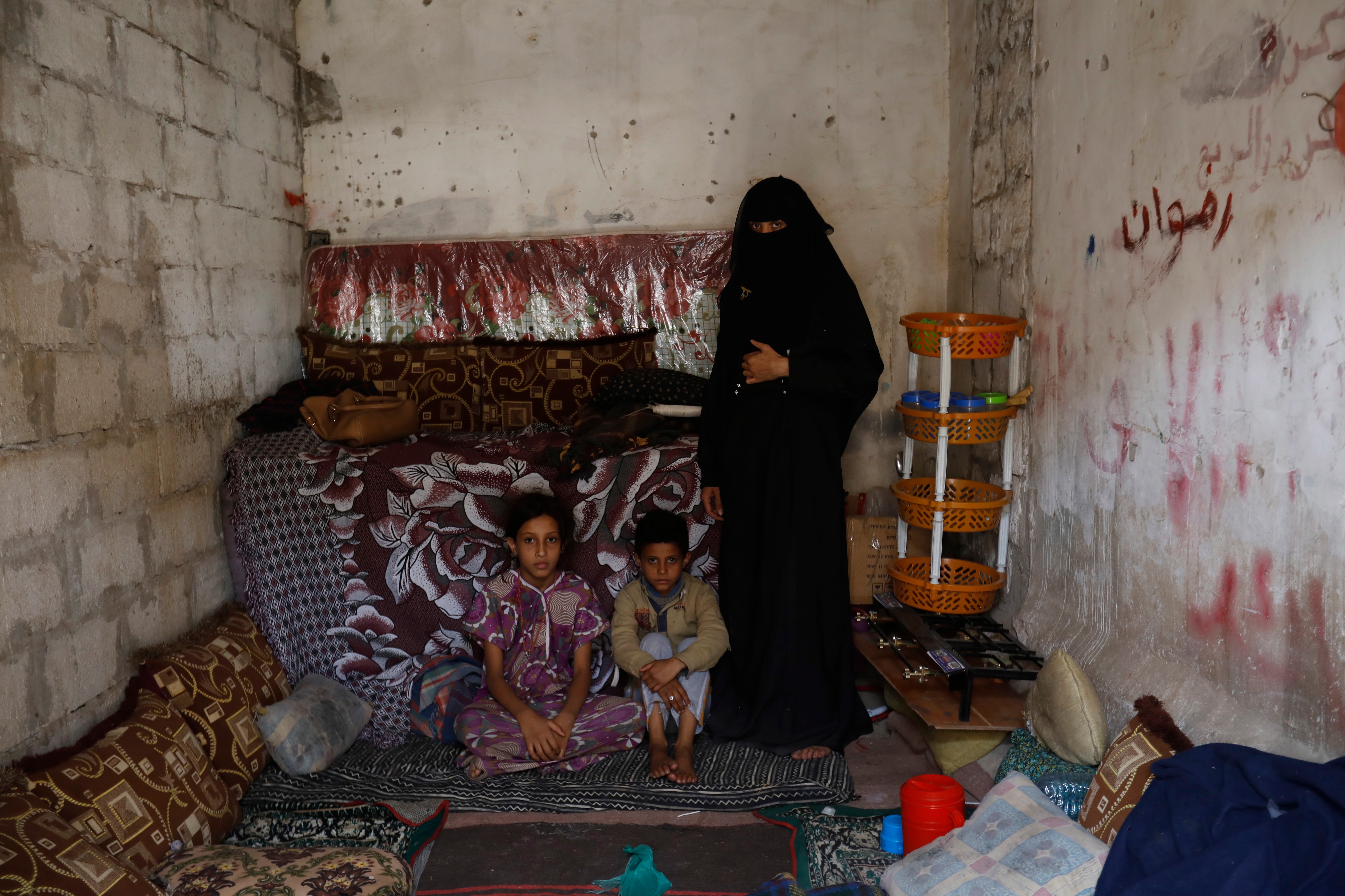 Conflict-affected members of a Yemeni family inside a one-room rental house, in Sanaa, Yemen.