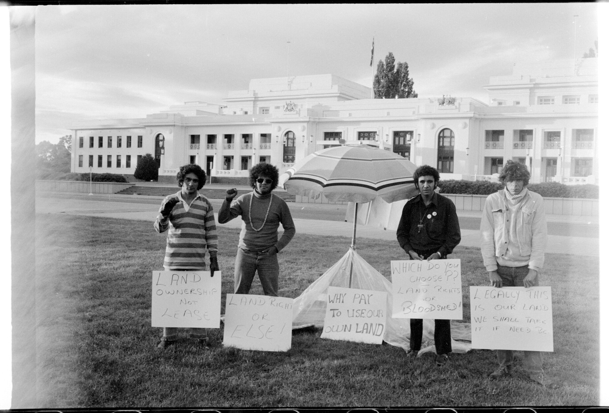 The Aboriginal Embassy during it's first day in 1972. Left to right: Billy Craigie, Bert Williams, Michael Anderson and Tony Coorey.