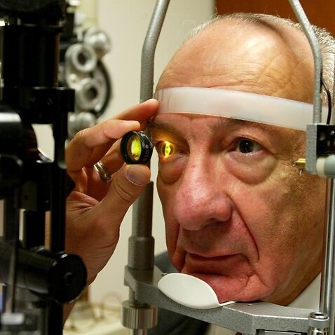 Ernest Hayeck has his eye's retina examined