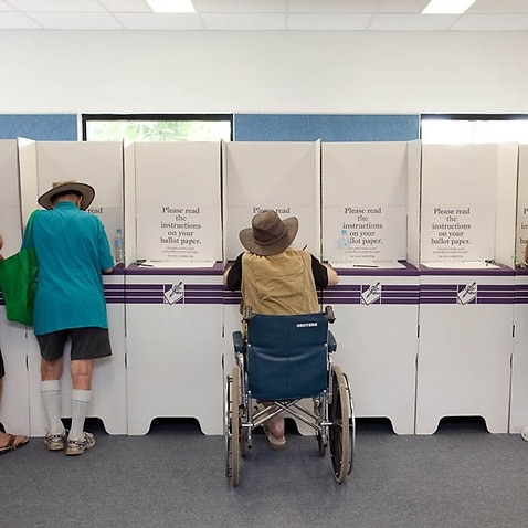 People in Darwin filling in their ballot papers at the last election 