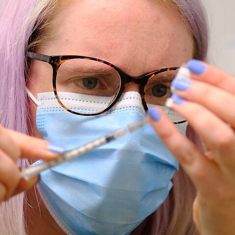 An employee at Melbourne's Midtown Medical Clinic prepares the Pfizer vaccine on Monday, 5 July, 2021.