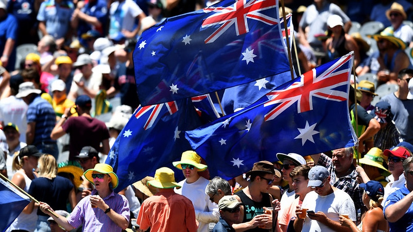 Fans wave their flags on Day Two of the Boxing Day test match between Australia and England.