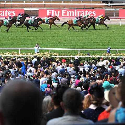 ockeys ride their horses to the finish line during race 2, the TAB.COM.AU trophy, on Melbourne Cup Day at Flemington Racecourse in Melbourne, Tuesday, Nov. 3, 2015. (AAP)