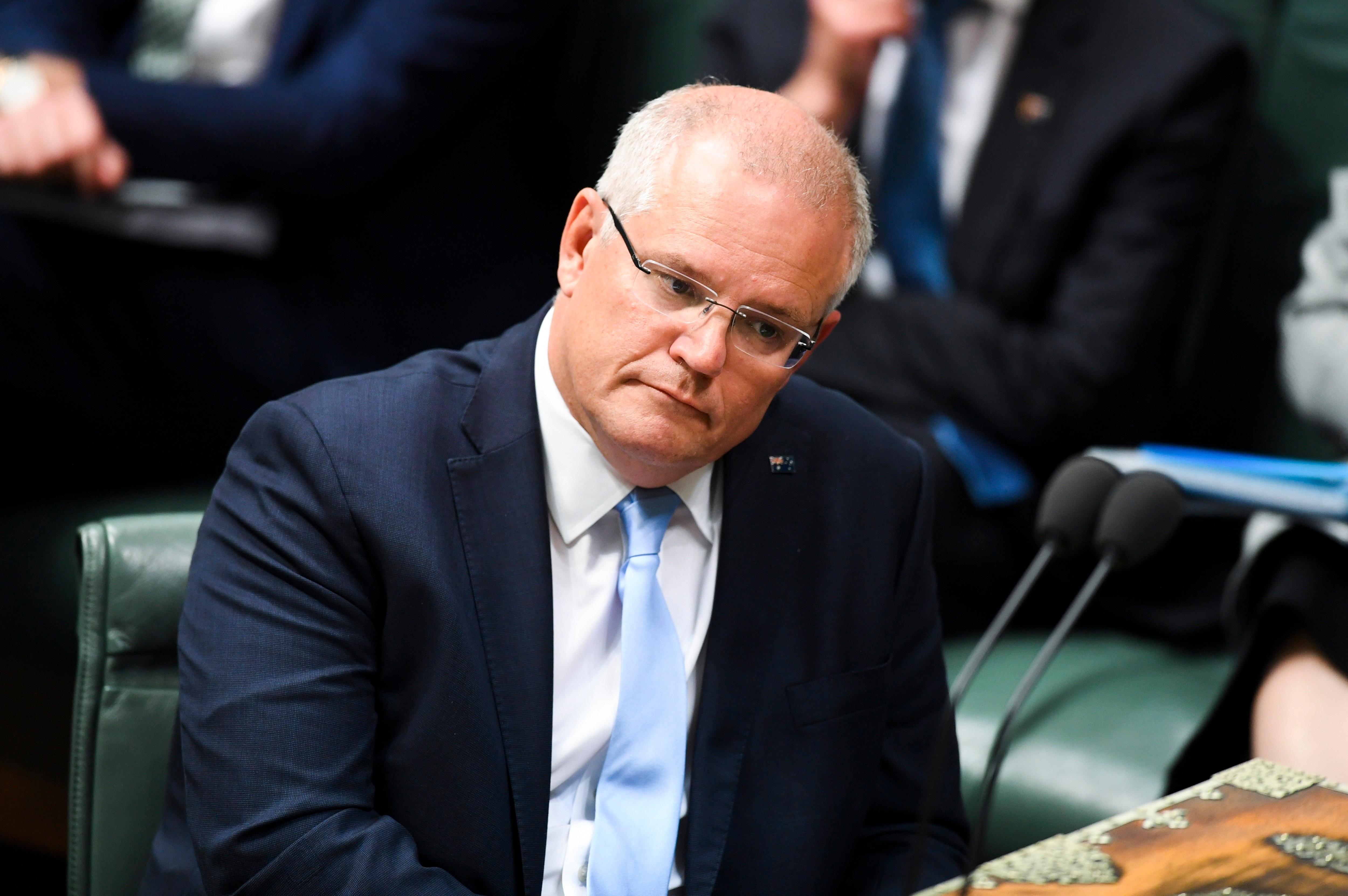 Australian Prime Minister Scott Morrison reacts during House of Representatives Question Time at Parliament House in Canberra.