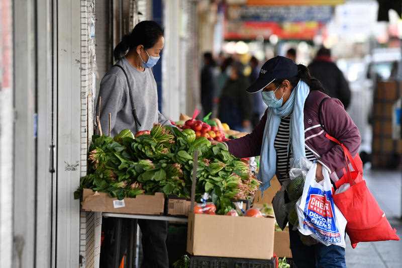 Shoppers wearing face masks on Beamish Street at Campsie in Sydney