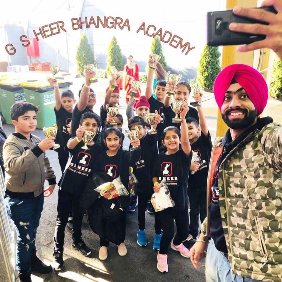 Gursher Singh Heer taking a selfie of some of the young participants at his dance academy. 