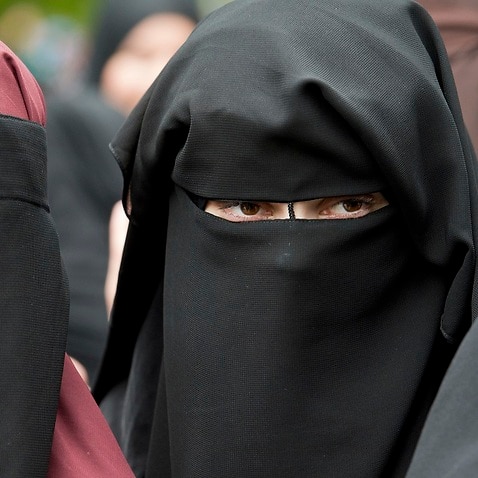 Denmark bans Islamic full-face veil in public spaces.
