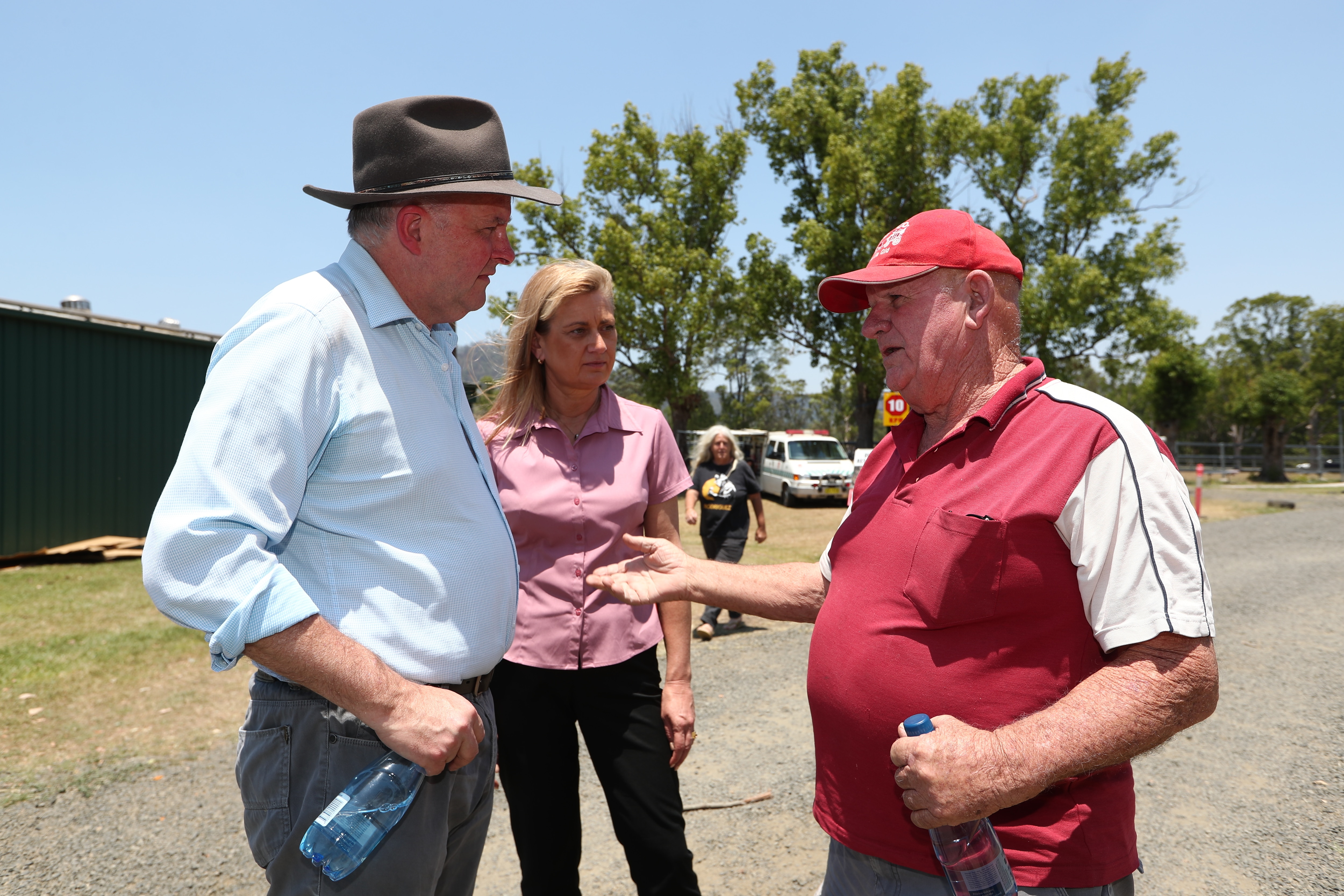 Opposition Leader Anthony Albanese speaks with Brian Hurrell in the bushfire affected area of Nimbin, New South Wales.