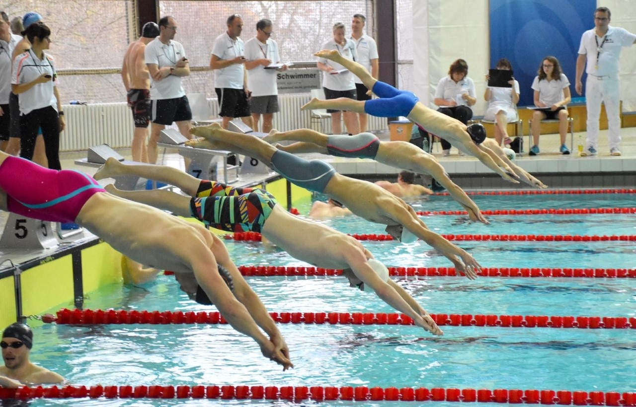 Alaa Maso (centre in grey swimming trunks) says he hopes to inspire others with his story.