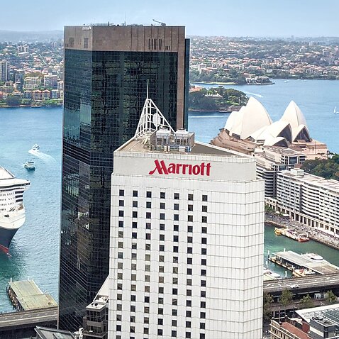 A guard at the Circular Quay Marriott Hotel has tested positive to coronavirus. 