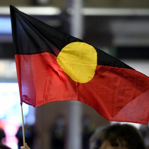 An Aboriginal flag is seen being flown in Sydney