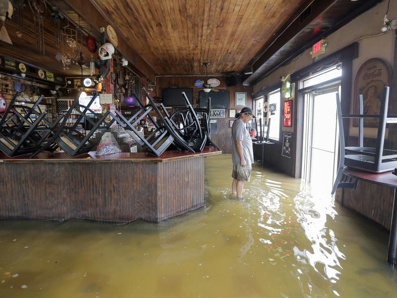 Louisiana officials are warning that Barry could cause disastrous flooding along the Gulf coast. (AAP) A business in Mandeville is flooded