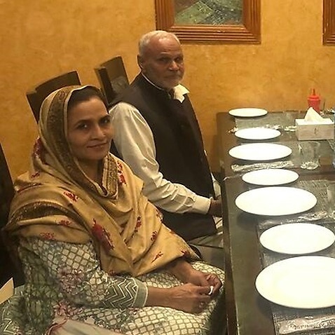 Haroon Iqbal with his mother and father.