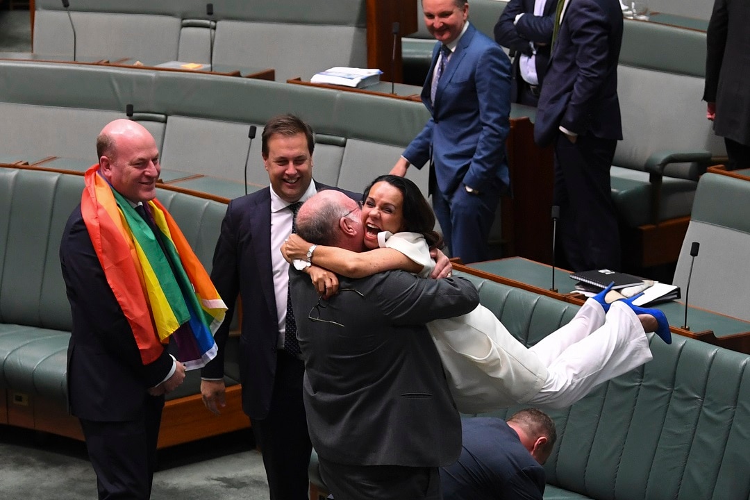 Burney hugs Liberal MP Warren Entsch as they celebrate the passing of the Marriage Amendment Bill on 28 November 2017. 