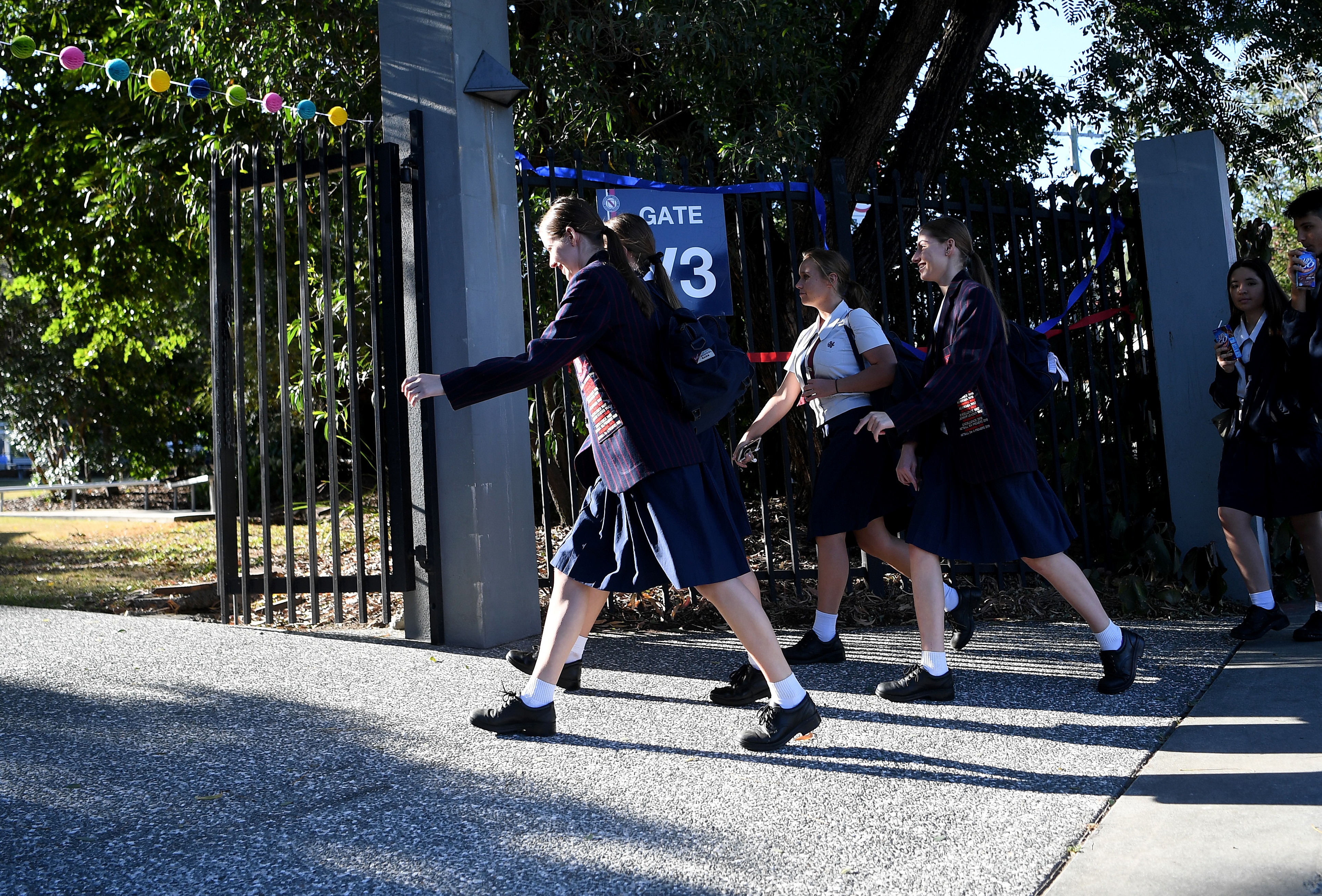 School students arrive for the first day of face-to-face schooling in Brisbane, 11 May.