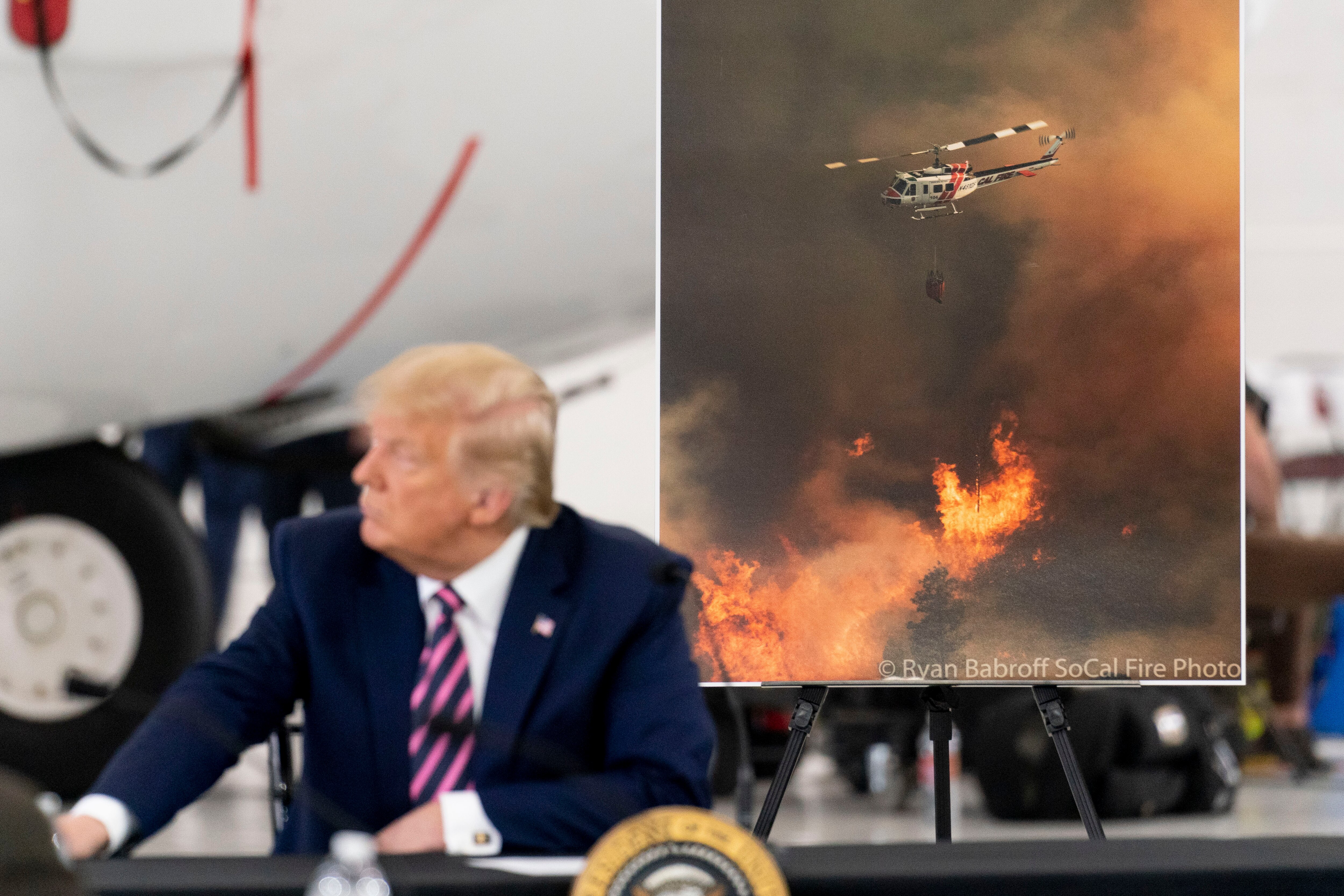 President Donald Trump participates in a briefing on wildfires at Sacramento McClellan Airport, California, Monday, 14 September, 2020. 