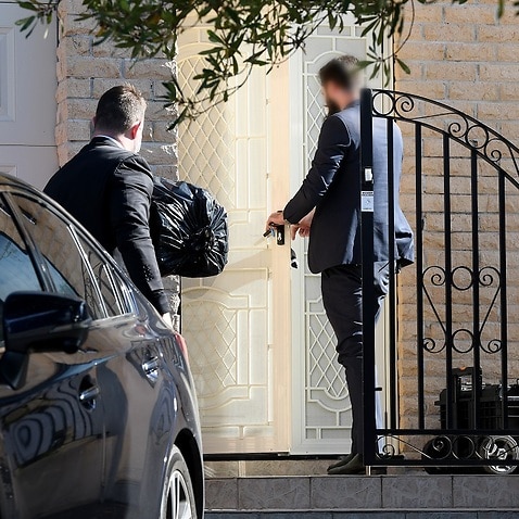 Federal agents enter the home of NSW Labor MP Shaoquett Moselmane in Rockdale, Sydney.