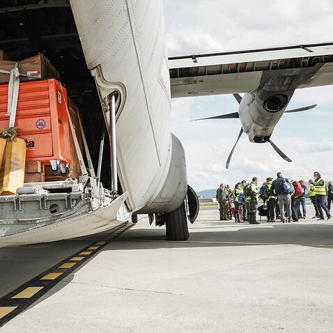 Oxygen production equipment is loaded onto a cargo aircraft in Italy, bound for India