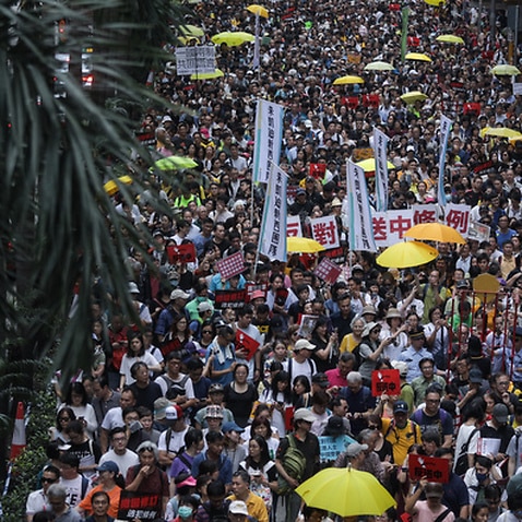 Demonstrators seen marching down Hong Kong's main roads